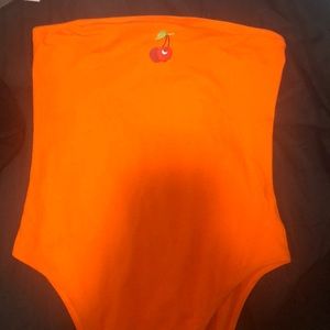 orange bodysuit w/cherry graphic